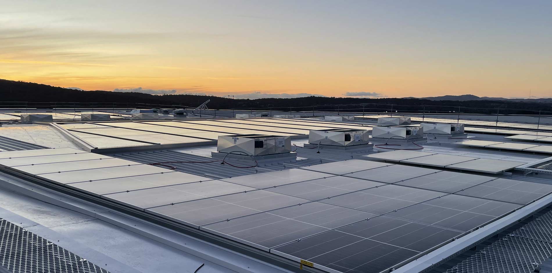 Solar panel installation by Meta Electrical & Solar β Canberra ACT and South Coast NSW Commercial solar panels installed on warehouse rooftop Canberra ACT